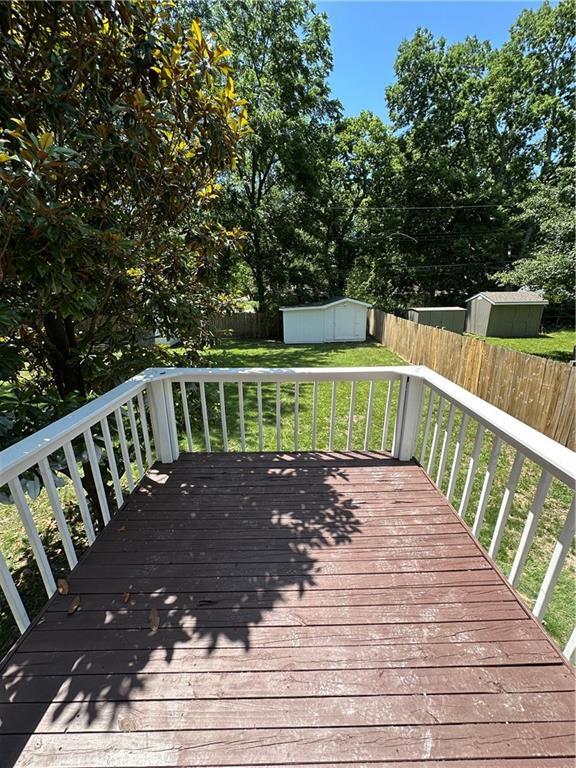 806 Lea Dr, Lees Summit, MO 64081 - deck featuring a shed and a fenced backyard