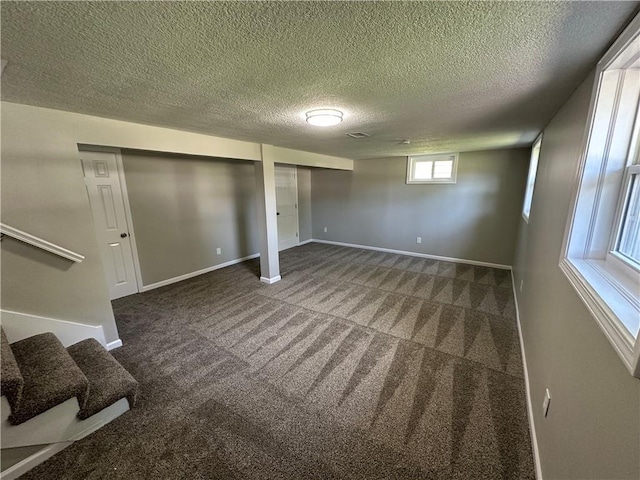806 Lea Dr, Lees Summit, MO 64081 - below grade area with carpet floors, a textured ceiling, and stairway