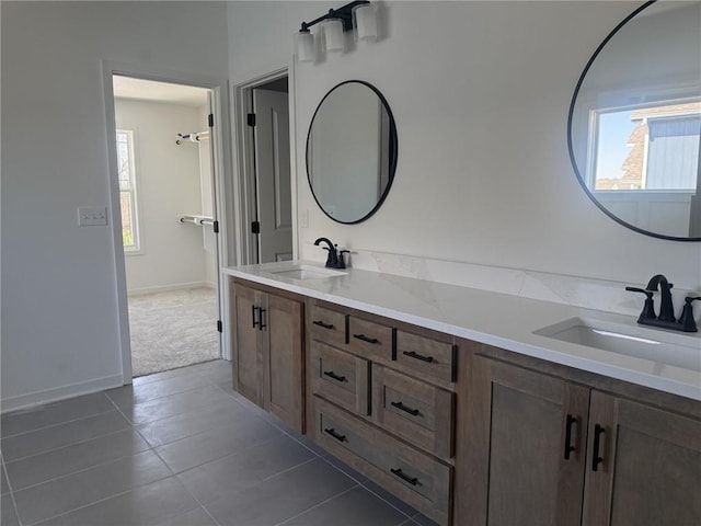 9011 N Colorado Ave, Kansas City, MO 64156 - bathroom with double vanity, healthy amount of natural light, and tile patterned flooring