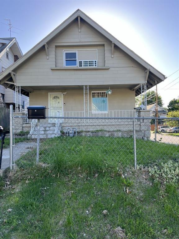144 N Brighton Ave, Kansas City, MO 64123 - bungalow-style house featuring covered porch