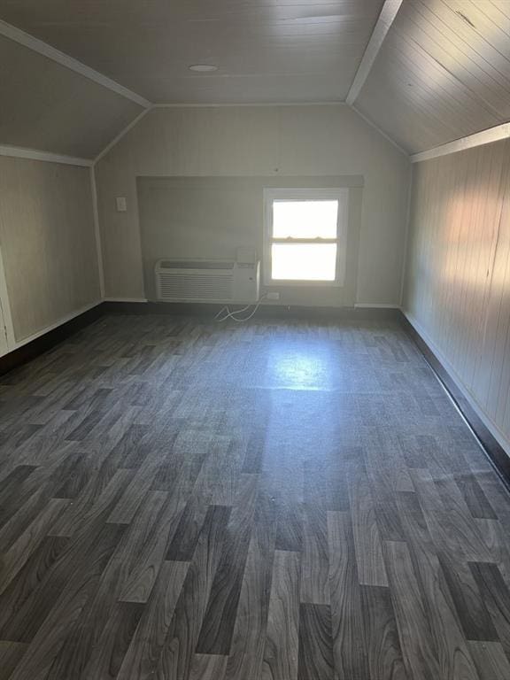 144 N Brighton Ave, Kansas City, MO 64123 - bonus room with an AC wall unit, lofted ceiling, and dark wood-type flooring