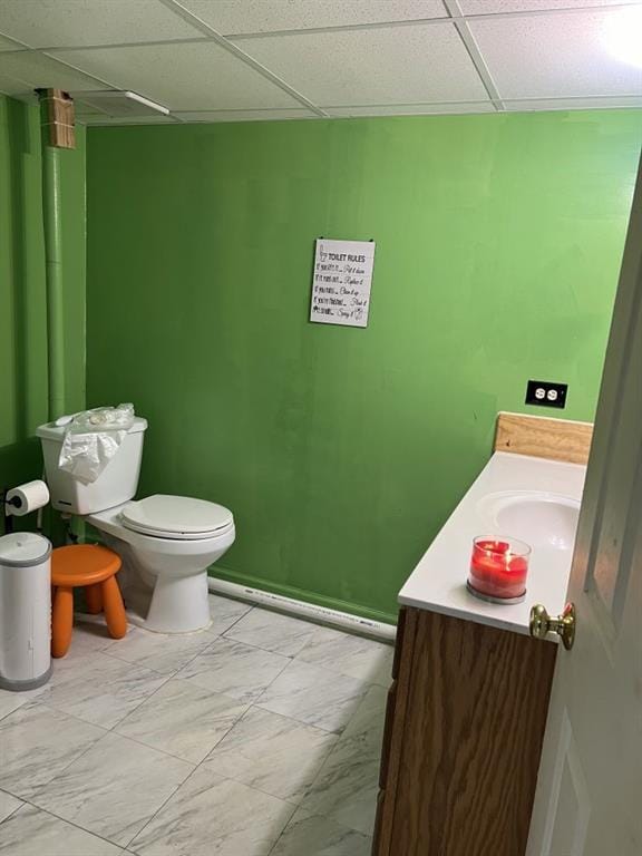 144 N Brighton Ave, Kansas City, MO 64123 - half bathroom with vanity and a paneled ceiling