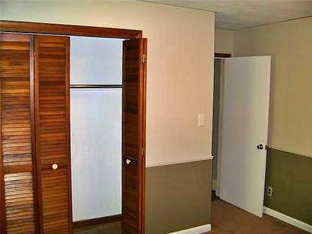 1915 S Broadway St, Pittsburg, KS 66762 - unfurnished bedroom featuring baseboards and a closet