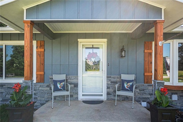37156 State Hwy N, Barnard, MO 64423 - entrance to property with a porch, stone siding, and board and batten siding