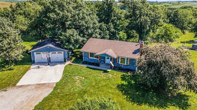 37156 State Hwy N, Barnard, MO 64423 - view of front of house featuring a garage, an outbuilding, a chimney, and a front yard