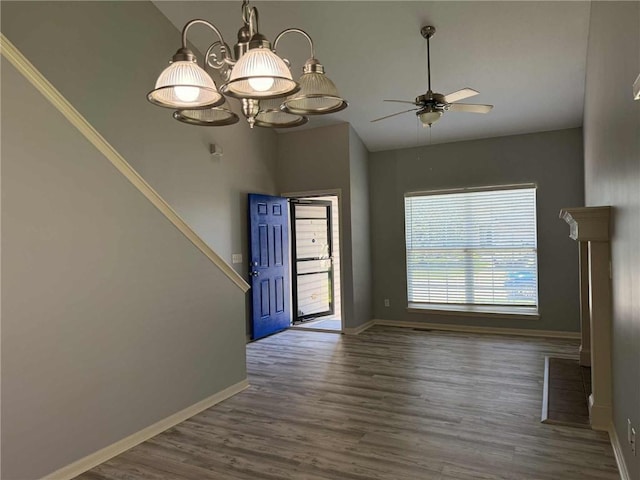 8808 NE 97th St, Kansas City, MO 64157 - empty room with wood finished floors, a ceiling fan, and lofted ceiling