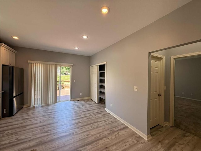 8808 NE 97th St, Kansas City, MO 64157 - spare room featuring light wood-type flooring and recessed lighting