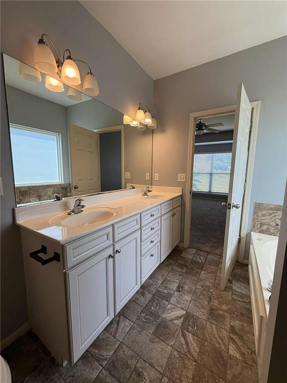 8808 NE 97th St, Kansas City, MO 64157 - bathroom featuring double vanity, a garden tub, and stone finish floors