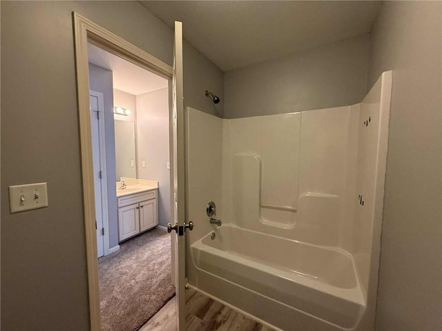8808 NE 97th St, Kansas City, MO 64157 - full bath featuring shower / tub combination, wood finished floors, and vanity