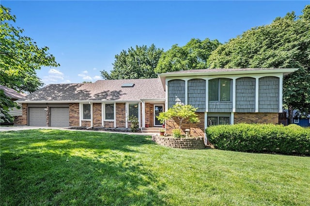 109 NE Locust St, Blue Springs, MO 64014 - tri-level home with a front yard, an attached garage, brick siding, and driveway