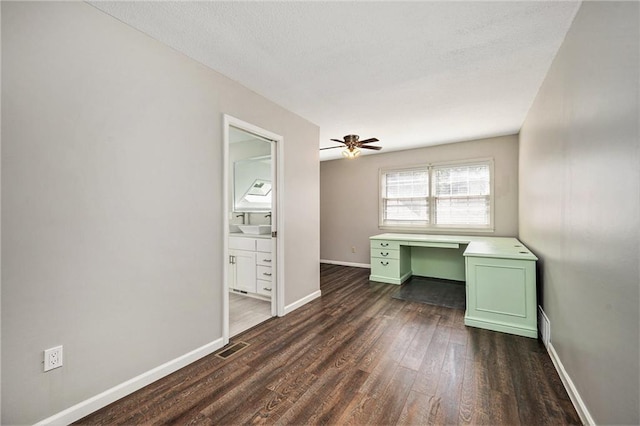 109 NE Locust St, Blue Springs, MO 64014 - unfurnished office featuring dark wood-style floors, a ceiling fan, and a textured ceiling