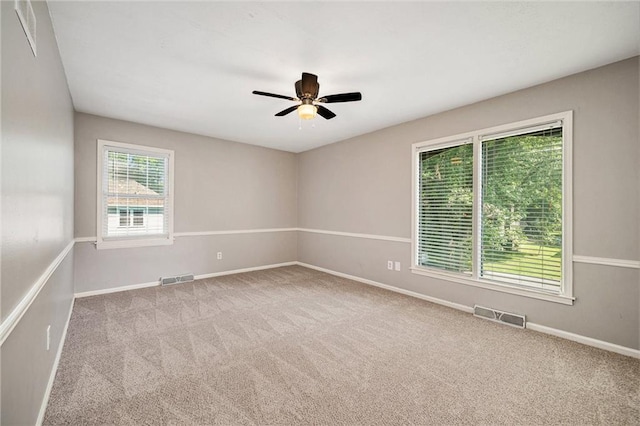 109 NE Locust St, Blue Springs, MO 64014 - spare room featuring a ceiling fan and carpet floors