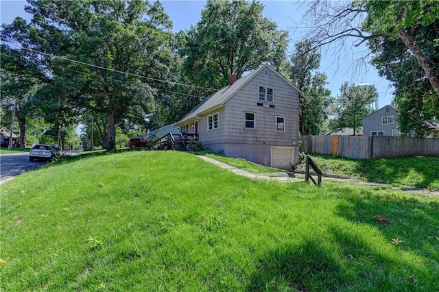 1700 S Pearl St, Independence, MO 64055 - view of side of home with a chimney and a garage