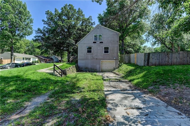 1700 S Pearl St, Independence, MO 64055 - view of home's exterior with concrete driveway and an attached garage