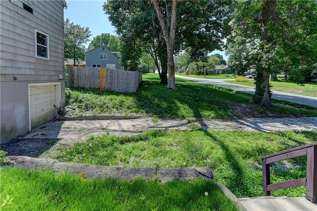 1700 S Pearl St, Independence, MO 64055 - view of yard with a garage and driveway