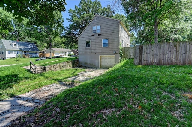 1700 S Pearl St, Independence, MO 64055 - view of home's exterior with driveway and a garage