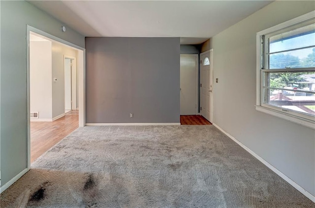 1700 S Pearl St, Independence, MO 64055 - spare room featuring carpet floors and baseboards