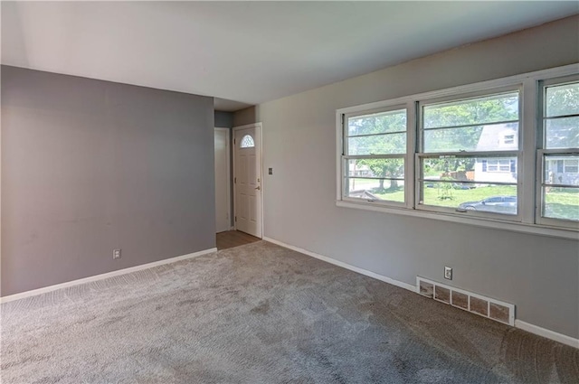 1700 S Pearl St, Independence, MO 64055 - carpeted spare room with plenty of natural light