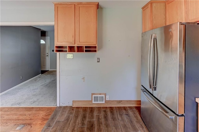 1700 S Pearl St, Independence, MO 64055 - kitchen with freestanding refrigerator, light brown cabinets, and dark wood-style floors