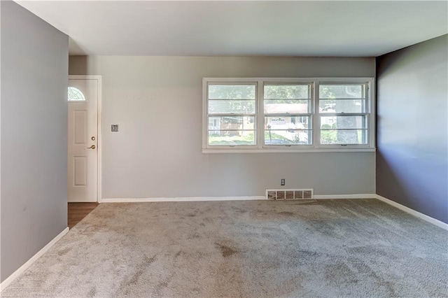 1700 S Pearl St, Independence, MO 64055 - carpeted empty room featuring baseboards