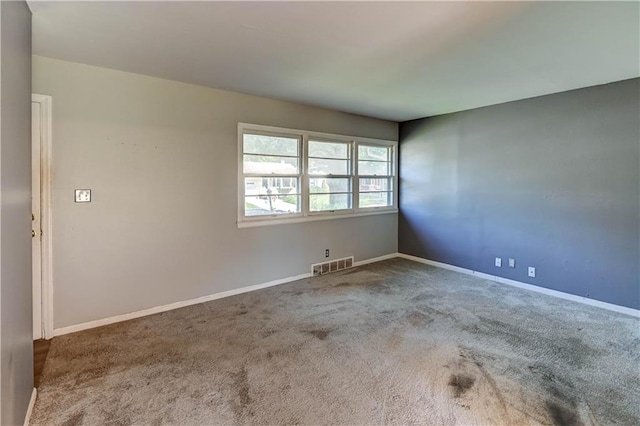 1700 S Pearl St, Independence, MO 64055 - carpeted empty room with baseboards