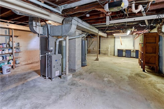 1700 S Pearl St, Independence, MO 64055 - unfinished basement with water heater and heating unit