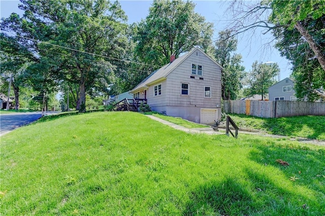 1700 S Pearl St, Independence, MO 64055 - view of side of home with a chimney and an attached garage