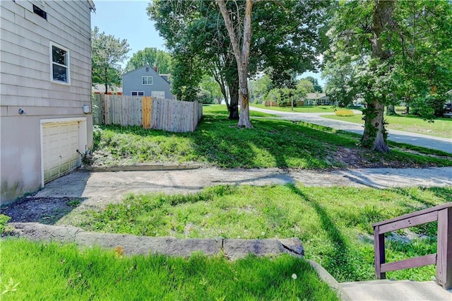 1700 S Pearl St, Independence, MO 64055 - view of yard featuring a garage and driveway