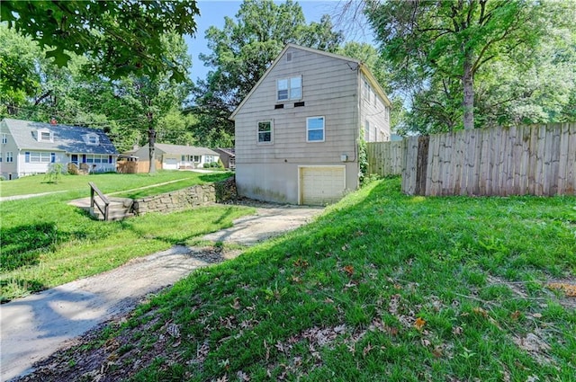 1700 S Pearl St, Independence, MO 64055 - view of property exterior with driveway and a garage