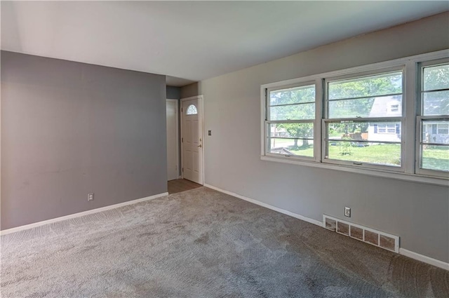 1700 S Pearl St, Independence, MO 64055 - unfurnished room with carpet floors and healthy amount of natural light