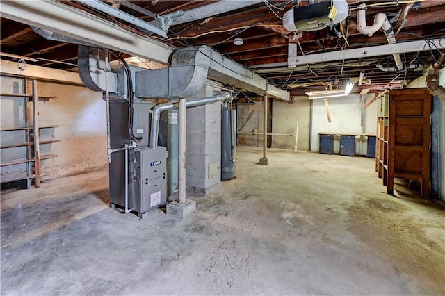 1700 S Pearl St, Independence, MO 64055 - unfinished basement with water heater and heating unit
