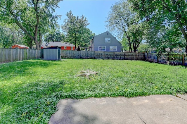 1700 S Pearl St, Independence, MO 64055 - fenced backyard featuring a shed