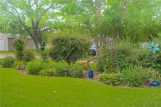 328 E 4th St, Lawson, MO 64062 - view of green lawn featuring a garage