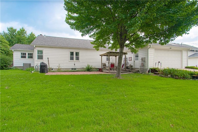 328 E 4th St, Lawson, MO 64062 - back of house featuring a lawn, an attached garage, and a patio
