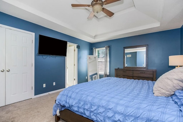 1311 Honeysuckle Ct, Liberty, MO 64068 - bedroom with a raised ceiling, carpet flooring, and a ceiling fan