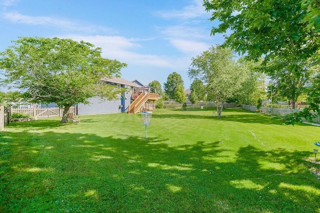 1311 Honeysuckle Ct, Liberty, MO 64068 - fenced backyard featuring stairs and a deck