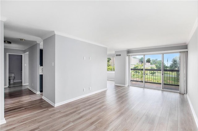 2525 Main St Unit 305, Kansas City, MO 64108 - empty room featuring light wood-style flooring and ornamental molding