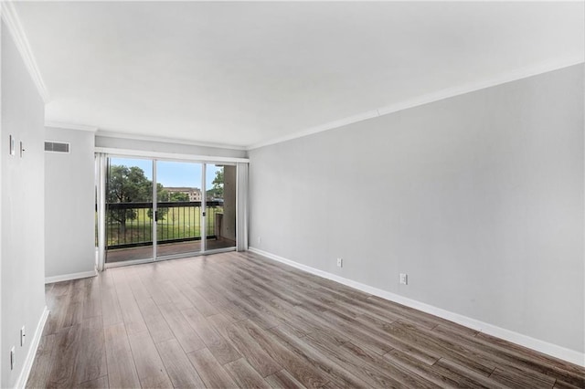 2525 Main St Unit 305, Kansas City, MO 64108 - unfurnished room featuring ornamental molding and wood finished floors