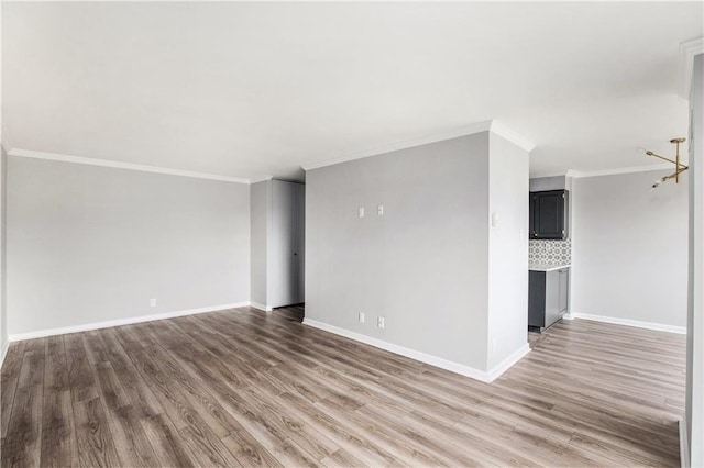 2525 Main St Unit 305, Kansas City, MO 64108 - spare room featuring wood finished floors and ornamental molding