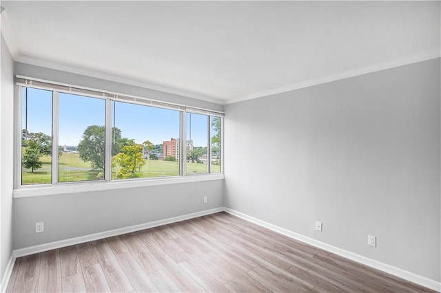 2525 Main St Unit 305, Kansas City, MO 64108 - spare room featuring ornamental molding and wood finished floors