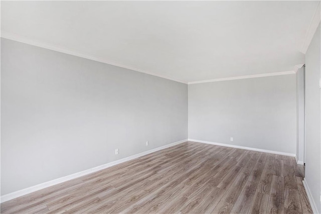 2525 Main St Unit 305, Kansas City, MO 64108 - spare room featuring wood finished floors and crown molding