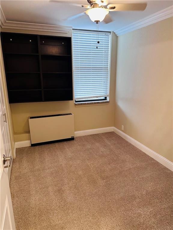 700 E 8th St Unit 4J, Kansas City, MO 64106 - unfurnished bedroom with ornamental molding, radiator, carpet, and a ceiling fan