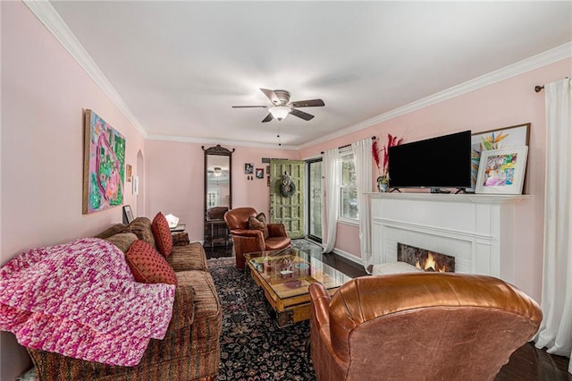 5147 Maple Ave, Mission, KS 66202 - living area with crown molding, a fireplace, wood finished floors, and ceiling fan