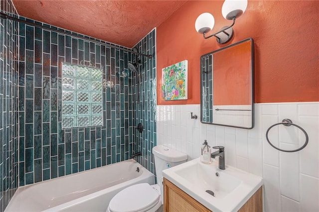 5147 Maple Ave, Mission, KS 66202 - full bath with tile walls, vanity, shower / bath combination, and a wainscoted wall