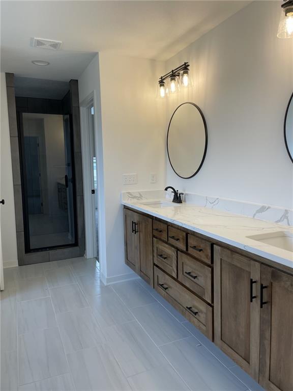 9015 N Colorado Ave, Kansas City, MO 64156 - bathroom featuring double vanity