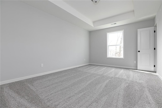 9015 N Colorado Ave, Kansas City, MO 64156 - empty room featuring carpet flooring and a raised ceiling