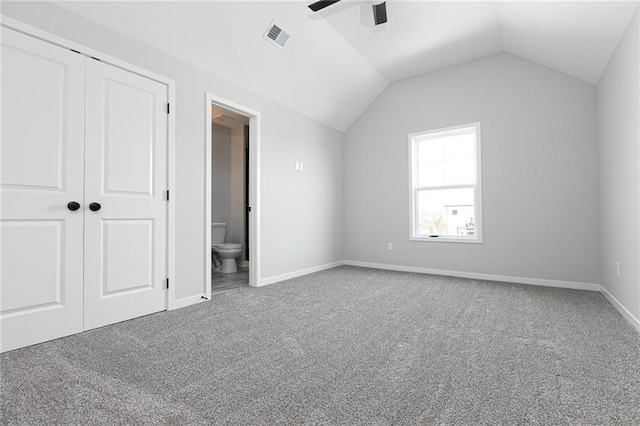 9015 N Colorado Ave, Kansas City, MO 64156 - unfurnished bedroom featuring carpet, vaulted ceiling, a closet, ceiling fan, and ensuite bathroom