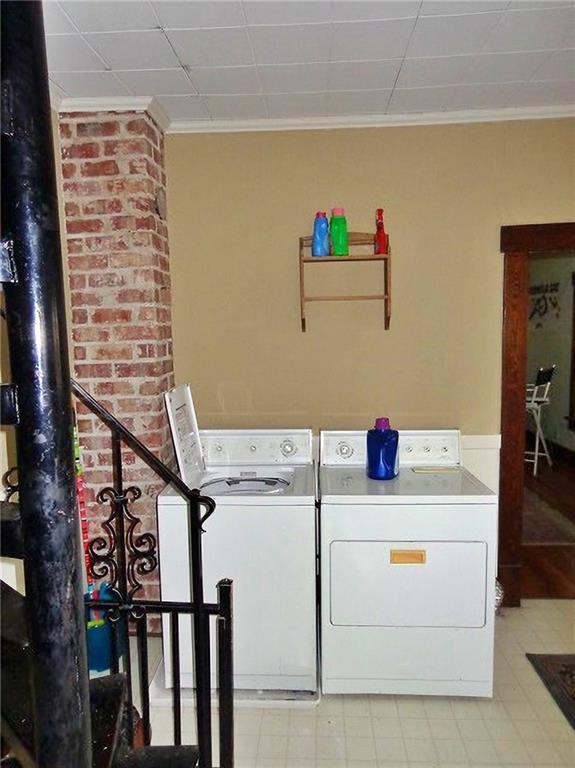 1909 S Broadway St, Pittsburg, KS 66762 - laundry room with separate washer and dryer and ornamental molding