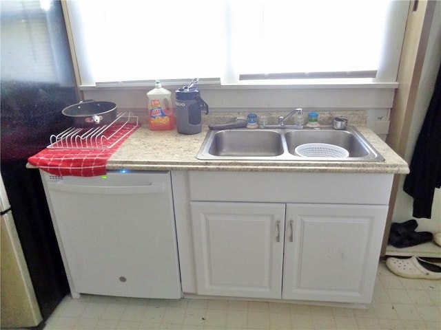 1909 S Broadway St, Pittsburg, KS 66762 - kitchen with dishwasher, healthy amount of natural light, light flooring, and white cabinetry