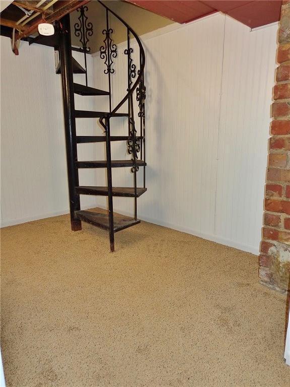 1909 S Broadway St, Pittsburg, KS 66762 - below grade area featuring carpet flooring and stairs